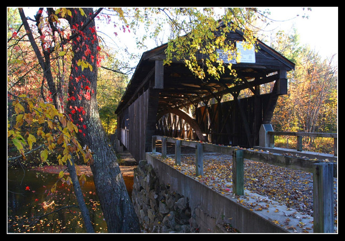 Left-side guardrail and covered Bridge - looking down its length - Whittier Covered Bridge in West Ossipee